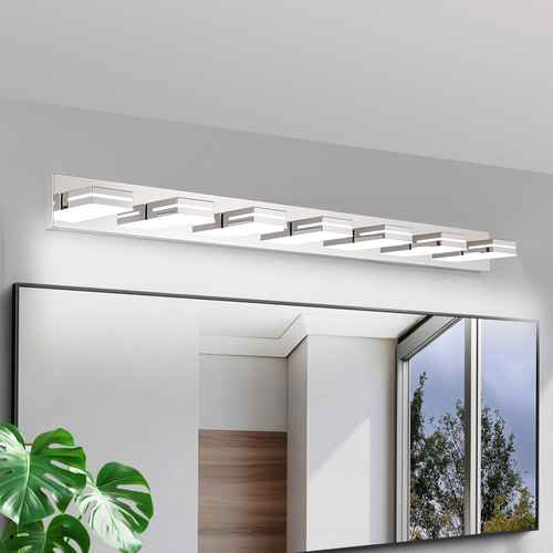 A modern rectangular wall-mounted light fixture with multiple frosted glass panels and metallic accents, installed above a large mirror in a bathroom setting.