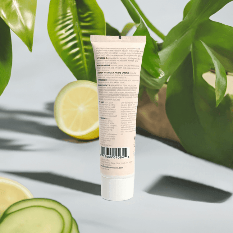 Tube of skincare product with lemon and cucumber slices on a light background
