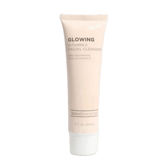 Tube of Glowing Vitamin C Facial Cleanser on a dark gray background