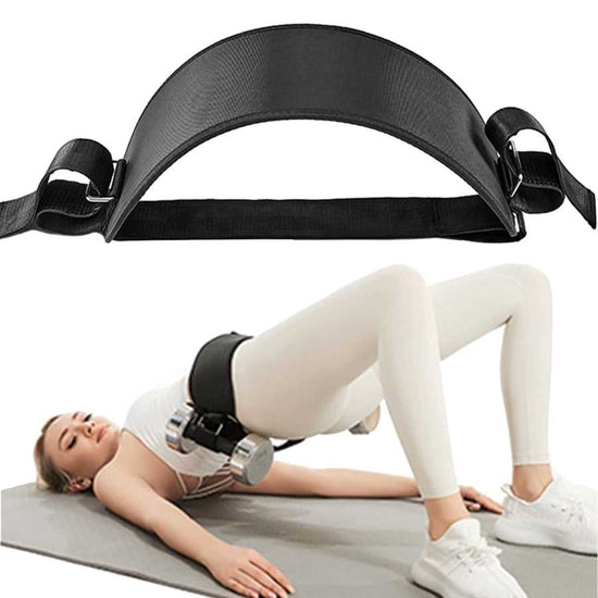 Black exercise belt being used by a person on a mat