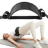 Black exercise belt being used by a person on a mat