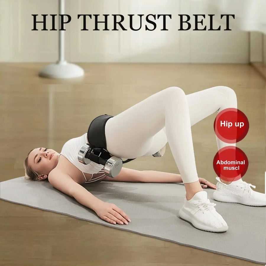 Person using a hip thrust belt with dumbbells on a mat, demonstrating exercise technique.