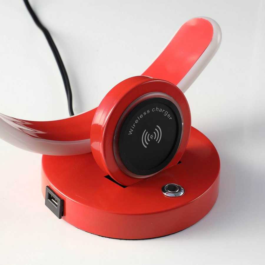 Red wireless charger with a black circular pad on a white background